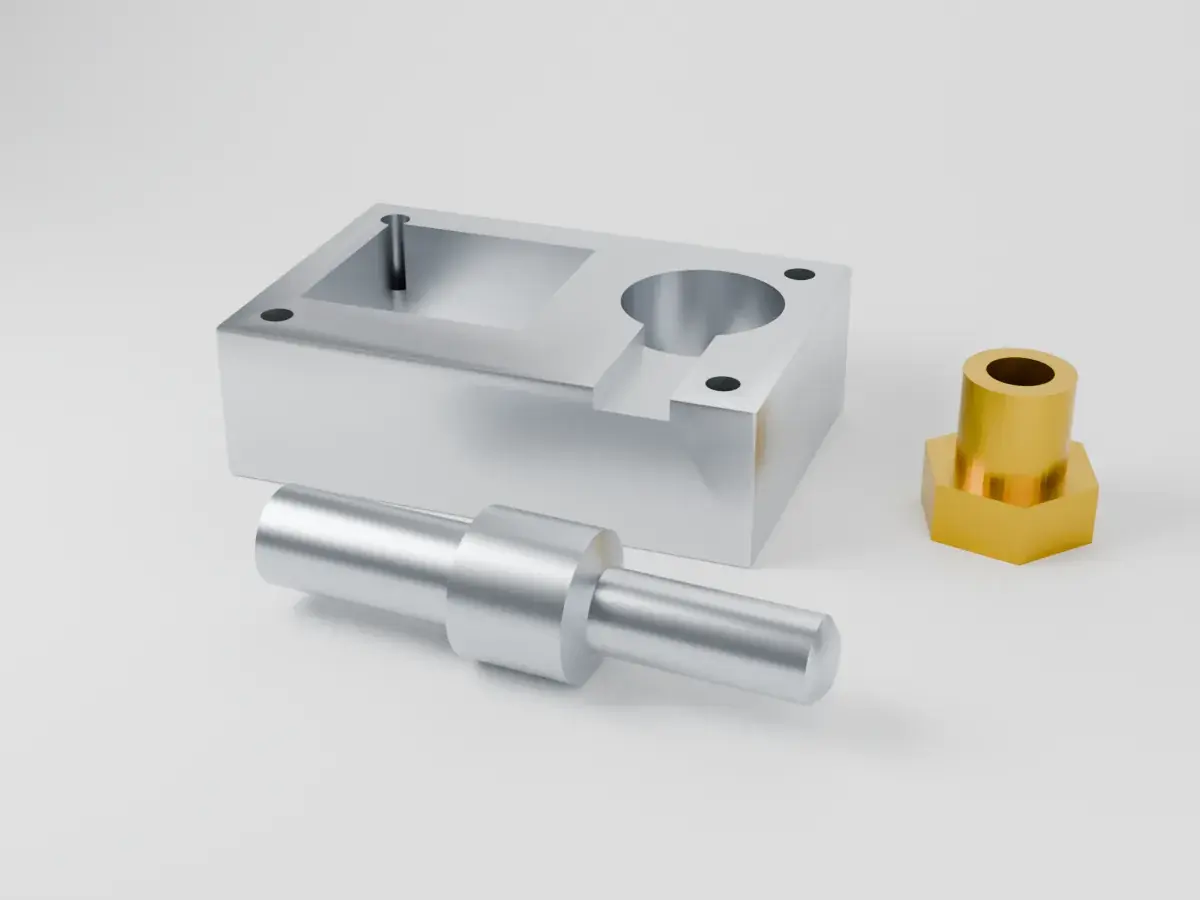 CNC-machined aluminium block with pockets, a turned steel shaft and a brass fitting